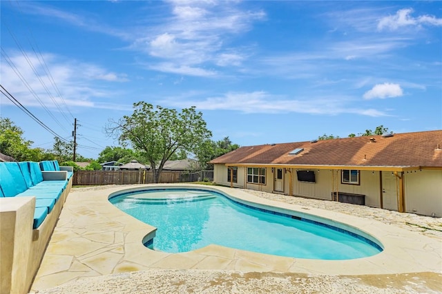 view of pool with a fenced backyard and a patio area