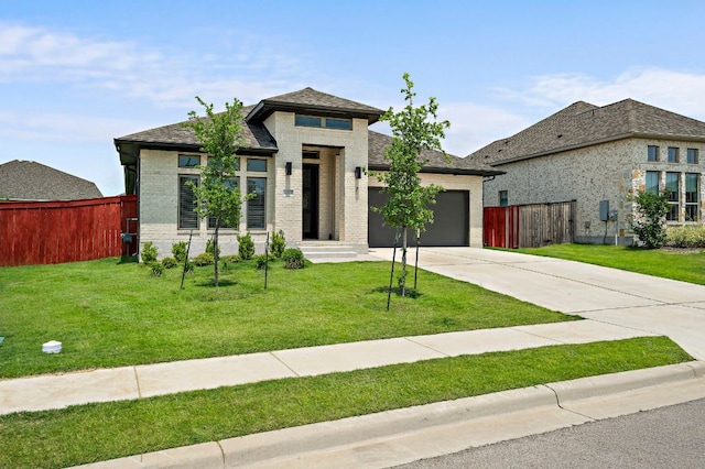 14505 Kira Ln, Manor, TX 78653 - view of front of home with driveway, brick siding, and a garage