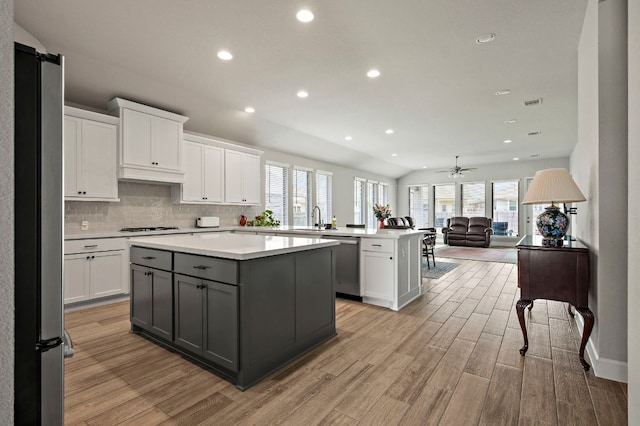 14505 Kira Ln, Manor, TX 78653 - kitchen featuring stainless steel appliances, a sink, light wood-type flooring, light countertops, and recessed lighting