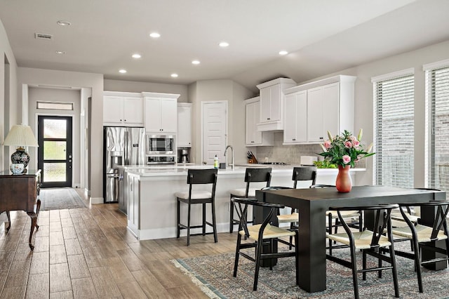 14505 Kira Ln, Manor, TX 78653 - dining space with recessed lighting, light wood-type flooring, and baseboards