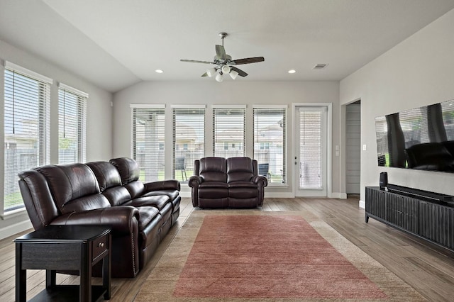 14505 Kira Ln, Manor, TX 78653 - living room with light wood finished floors, ceiling fan, healthy amount of natural light, vaulted ceiling, and recessed lighting