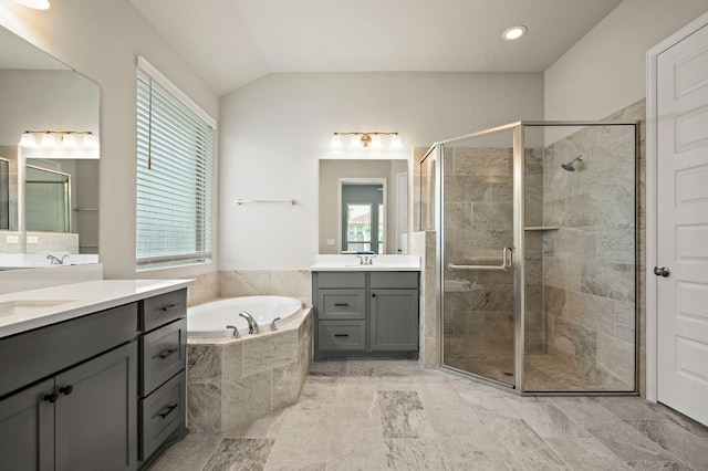 14505 Kira Ln, Manor, TX 78653 - bathroom with two vanities, healthy amount of natural light, a shower stall, a bath, and lofted ceiling