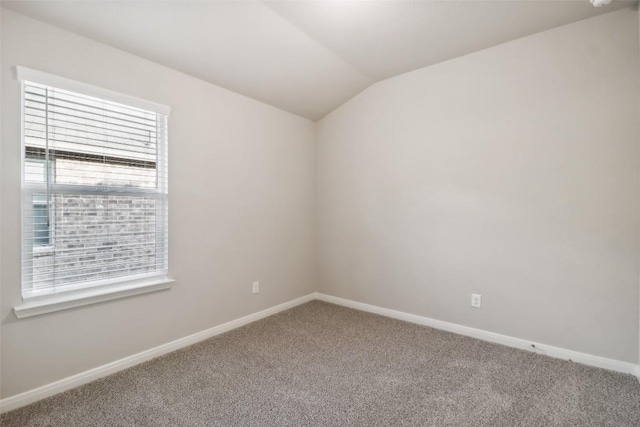 832 Sun Grove Trl, Georgetown, TX 78628 - empty room with carpet floors, vaulted ceiling, and baseboards