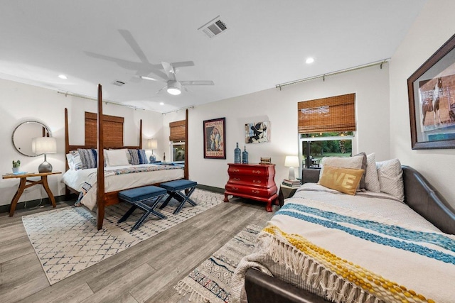 bedroom featuring wood finished floors, recessed lighting, baseboards, and a ceiling fan