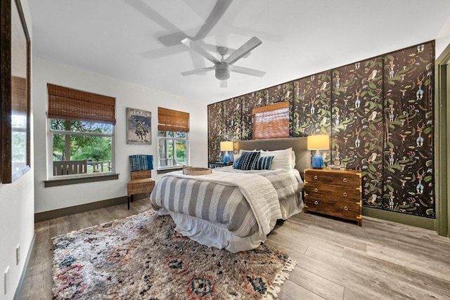 bedroom with wood finished floors and ceiling fan