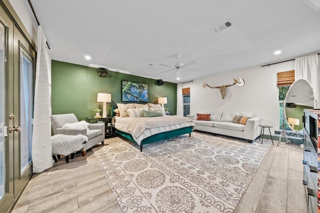 bedroom featuring light wood-type flooring, recessed lighting, and ceiling fan