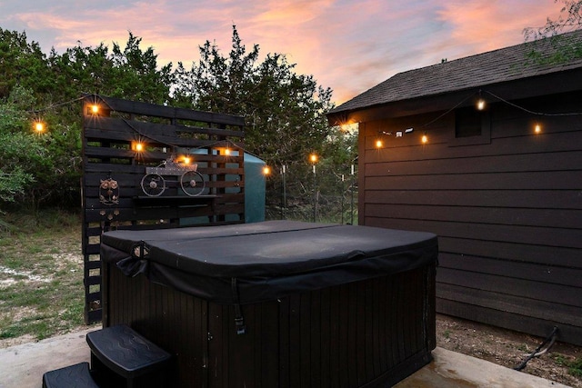 view of patio / terrace with a hot tub