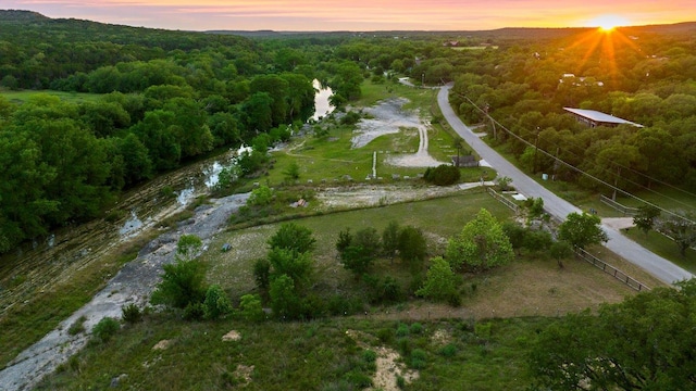 aerial view at dusk of a wooded view