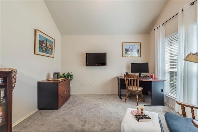 home office with vaulted ceiling, baseboards, and carpet flooring