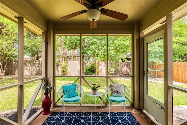 sunroom with a ceiling fan
