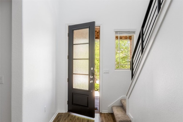 1203 Diggy Dr, Austin, TX 78748 - foyer entrance featuring dark wood-style floors, stairway, and baseboards