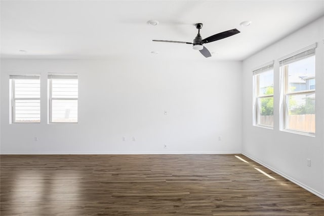 1203 Diggy Dr, Austin, TX 78748 - empty room featuring dark wood-style floors, baseboards, and ceiling fan