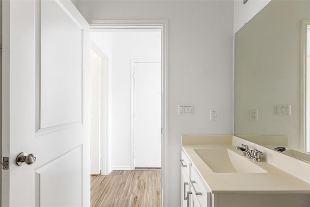 1203 Diggy Dr, Austin, TX 78748 - bathroom with vanity and wood finished floors