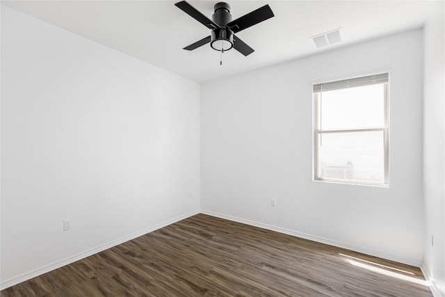 1203 Diggy Dr, Austin, TX 78748 - empty room featuring dark wood finished floors, ceiling fan, and baseboards