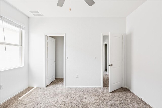 1203 Diggy Dr, Austin, TX 78748 - unfurnished bedroom featuring carpet flooring and ceiling fan