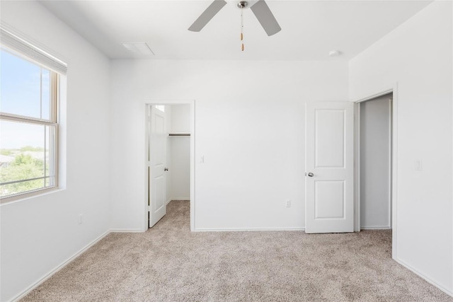 1203 Diggy Dr, Austin, TX 78748 - unfurnished bedroom featuring carpet flooring, a spacious closet, and ceiling fan