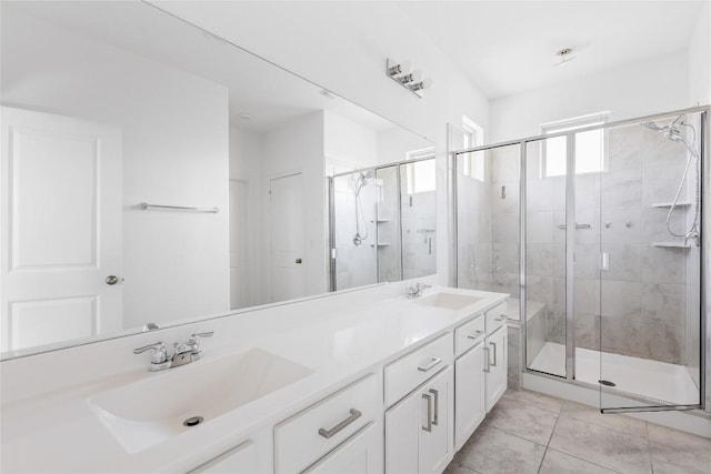 1203 Diggy Dr, Austin, TX 78748 - bathroom featuring double vanity and a shower stall