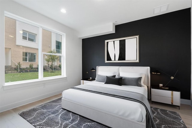 2805 Mccurdy St Unit 2, Austin, TX 78723 - bedroom with wood finished floors, baseboards, and recessed lighting