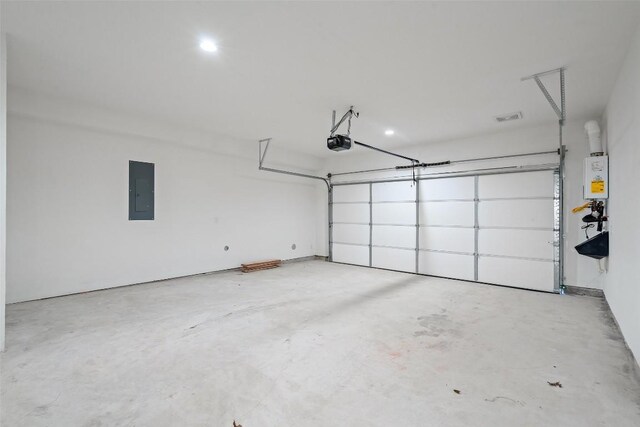 2805 Mccurdy St Unit 2, Austin, TX 78723 - garage with a garage door opener and electric panel