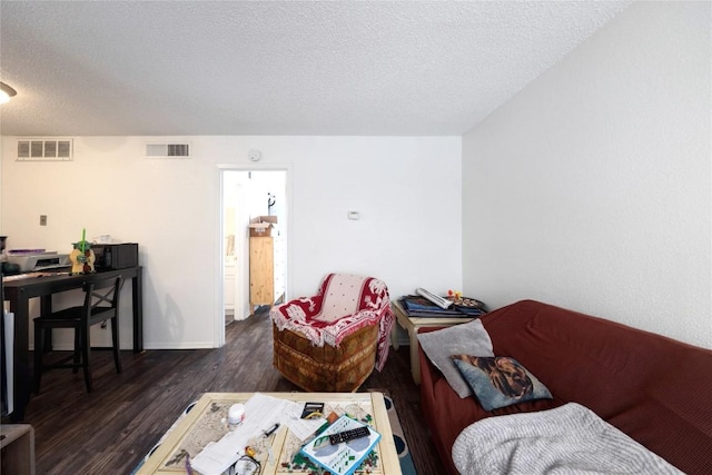 2803 Hemphill Park Unit B204, Austin, TX 78705 - living area featuring wood finished floors, a textured ceiling, and baseboards