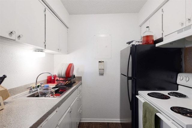 2803 Hemphill Park Unit B204, Austin, TX 78705 - kitchen with electric stove, under cabinet range hood, a sink, dark wood-style flooring, and white cabinetry