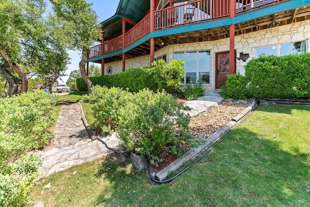 9038 Eagles Vw, Spring Branch, TX 78070 - rear view of house with stone siding, a lawn, and a wooden deck