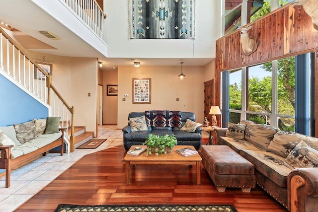 9038 Eagles Vw, Spring Branch, TX 78070 - living room featuring a towering ceiling, stairway, and light wood finished floors