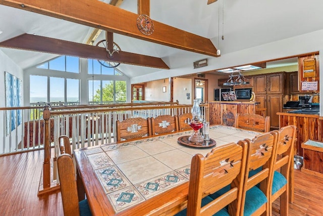 9038 Eagles Vw, Spring Branch, TX 78070 - dining space with beamed ceiling, wood finished floors, high vaulted ceiling, and a ceiling fan