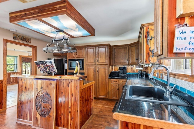 9038 Eagles Vw, Spring Branch, TX 78070 - kitchen with a sink, black appliances, a center island, and dark wood finished floors