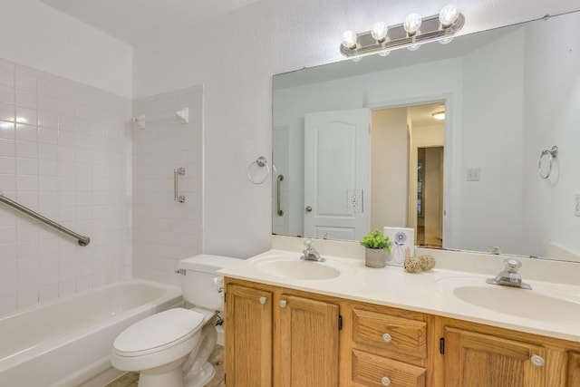 full bath with toilet, double vanity, and washtub / shower combination