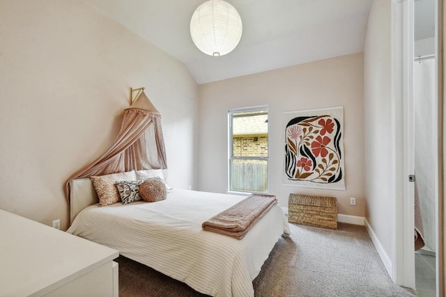 bedroom featuring carpet, vaulted ceiling, and baseboards