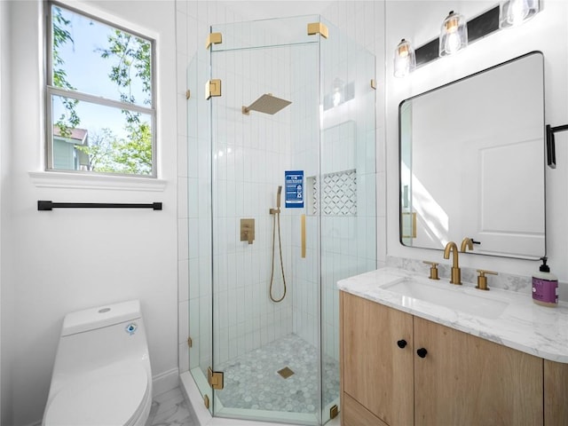 5209 Evans Ave, Austin, TX 78751 - full bathroom featuring vanity, toilet, a stall shower, marble finish flooring, and baseboards