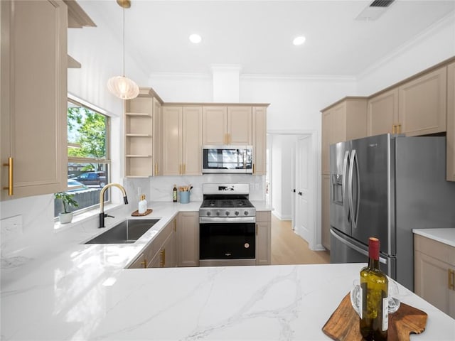 5209 Evans Ave, Austin, TX 78751 - kitchen with appliances with stainless steel finishes, open shelves, a sink, light stone counters, and ornamental molding