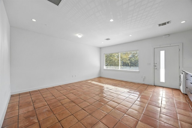 foyer with light tile patterned floors, recessed lighting, and baseboards