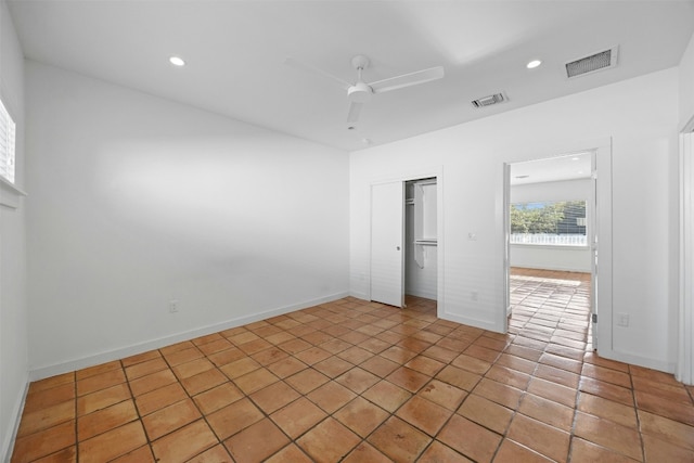 unfurnished bedroom featuring recessed lighting, a closet, a ceiling fan, light tile patterned flooring, and baseboards