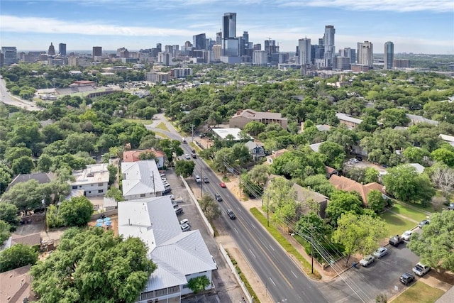 bird's eye view of a skyline view and a tree filled landscape