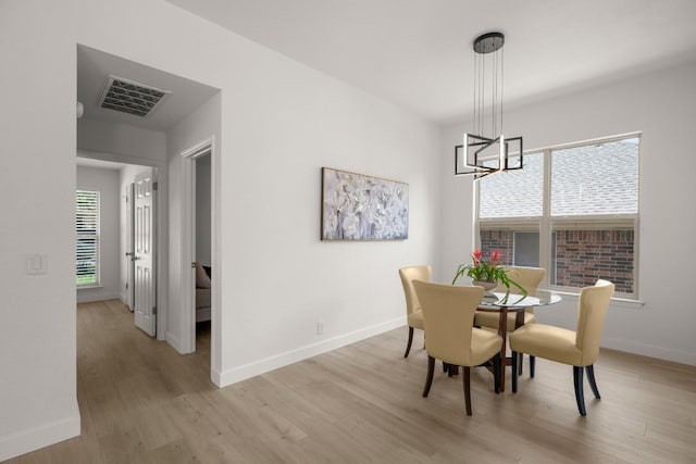 9127 Edwardson Ln, Austin, TX 78749 - dining space featuring a chandelier and light wood-type flooring