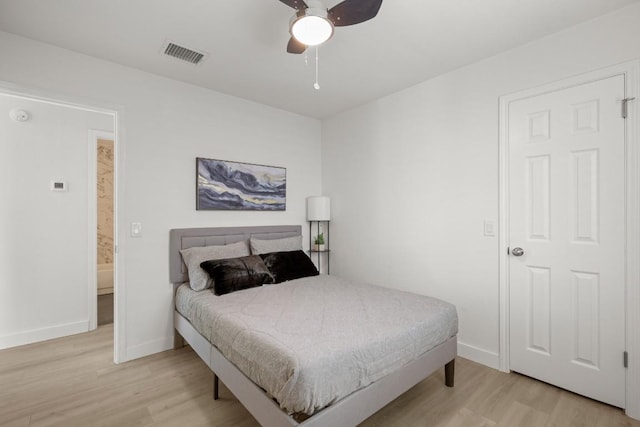 9127 Edwardson Ln, Austin, TX 78749 - bedroom with light wood finished floors and a ceiling fan