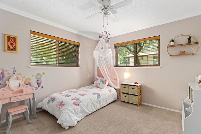 carpeted bedroom featuring multiple windows, ornamental molding, a textured ceiling, and baseboards