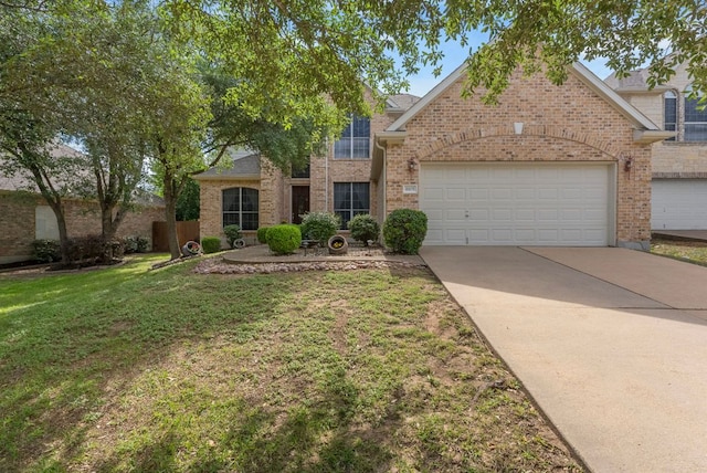 8105 Red Bird Ct, Austin, TX 78726 - traditional-style house with a front yard, an attached garage, brick siding, and concrete driveway