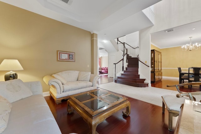 8105 Red Bird Ct, Austin, TX 78726 - living room featuring wood finished floors, ornamental molding, stairs, and a chandelier