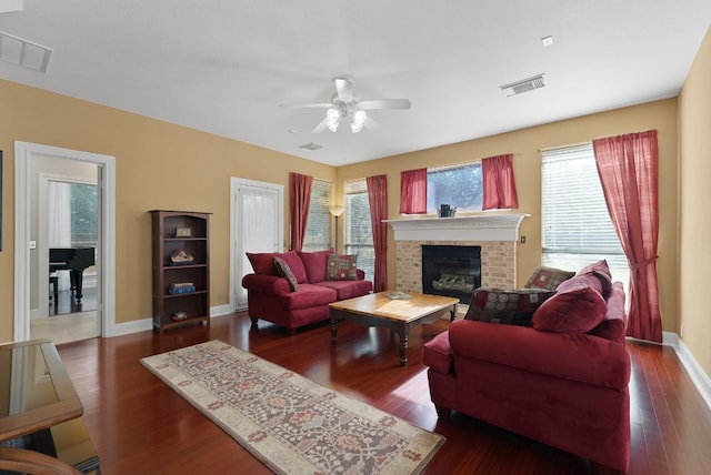 8105 Red Bird Ct, Austin, TX 78726 - living room with a ceiling fan, a fireplace, healthy amount of natural light, and wood finished floors