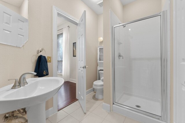 8105 Red Bird Ct, Austin, TX 78726 - bathroom with a stall shower and tile patterned floors