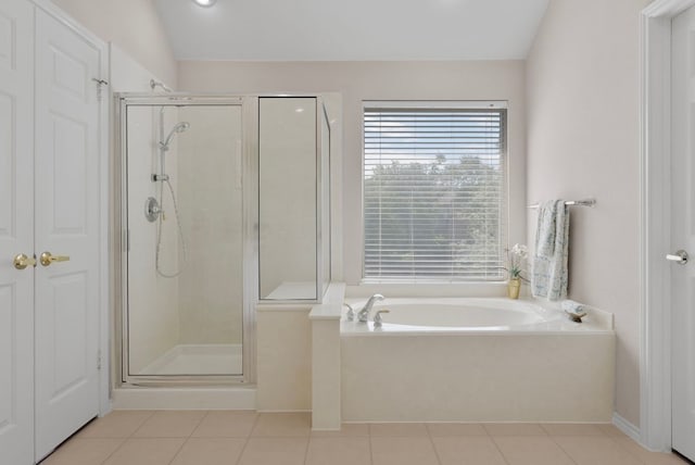 8105 Red Bird Ct, Austin, TX 78726 - bathroom featuring a stall shower, a bath, and tile patterned floors