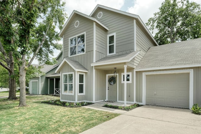 1008 E 3rd St, Georgetown, TX 78626 - view of front of house with roof with shingles, a garage, driveway, a front yard, and board and batten siding