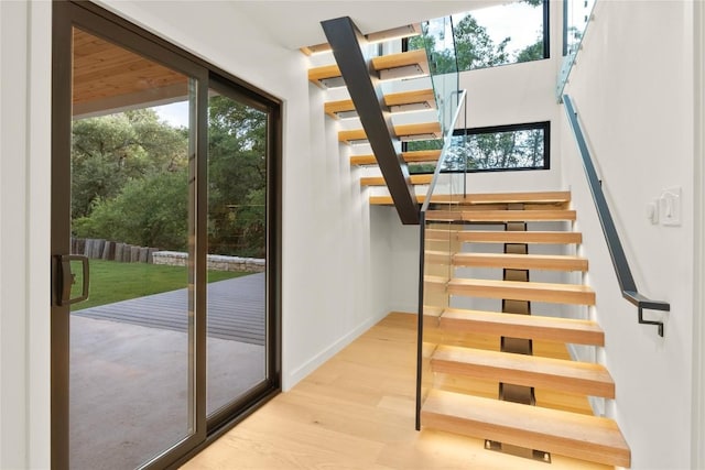 620 Bermuda St, Lakeway, TX 78734 - stairway featuring wood finished floors and baseboards