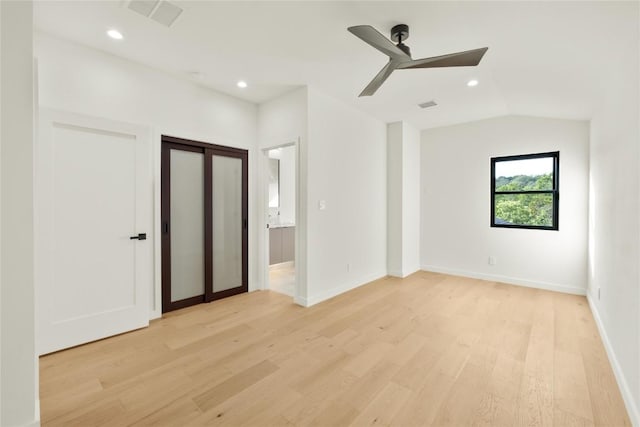 620 Bermuda St, Lakeway, TX 78734 - unfurnished bedroom with light wood-style flooring, recessed lighting, lofted ceiling, ensuite bath, and baseboards