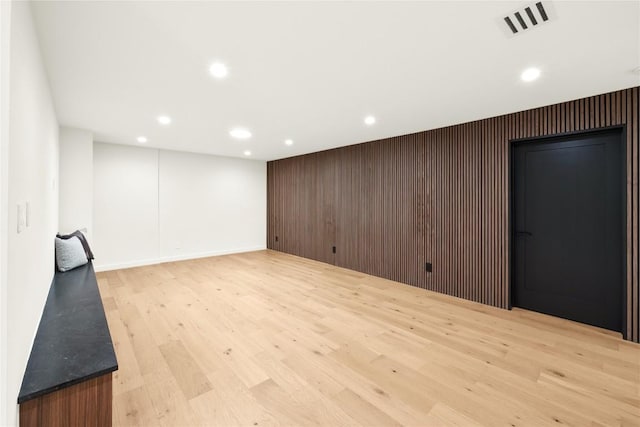 620 Bermuda St, Lakeway, TX 78734 - below grade area featuring recessed lighting, light wood-style floors, an accent wall, and baseboards