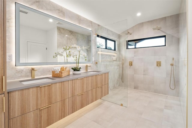 620 Bermuda St, Lakeway, TX 78734 - full bath with double vanity, a walk in shower, plenty of natural light, vaulted ceiling, and recessed lighting