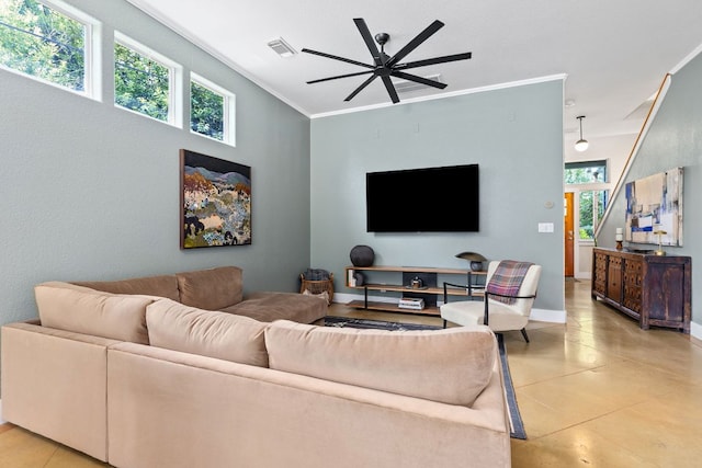 living area featuring ceiling fan, baseboards, crown molding, and light tile patterned floors